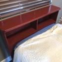 Single bed with headboard and bedding
