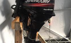 05 15 Hp Mercury outboard. 4 stroke long shaft with tiller handle, charging system, electric and manual start. Runs like new, serviced regularly. Only reason I'm selling is because it won't fit on my new boat