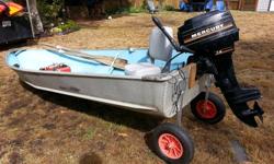 12-foot Aluminum boat with 7.5 HP Mercury Outboard motor and launch wheels. Comes with a metal gas tank, one cushioned seat and two oars. I installed the launch wheels and replaced the transom last year. Motor was tuned up last year and runs well. I have