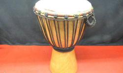 16 inch djembe drum, inventory #137857-1. Features cow edging around skin. Price of $99 includes all taxes. PLEASE REFER TO INVENTORY #137857-1 WHEN INQUIRING. We also have more items for sale at The Bay Street Broker located on the corner of Bay and
