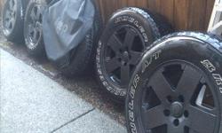 5 Bridgestone Dueller A/T 255 70R18, M & S (Mud & Snow). Tread - 4 at 75%, 1 at 100%. 5 spoke Mags and 1 spare tire cover