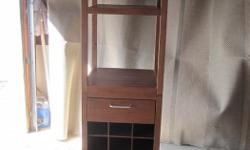 This unit will hold 18 bottles of your favorite wine. It has a drawer for storing your opener along with your other accessories. The upper wine glass storage area will keep your wine glasses handy and dust free.
Asking $80 / open to offers