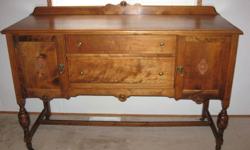 Sideboard measures 60"Lx22"Wx38"H, silverware drawer, linen drawer,
2 side cupboards with shelves.  Table measures 42"W x 52"L, comes with one leaf.  5 Chairs (one with arms), all with orig. leather seats.