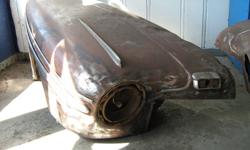 Two 1946 Ford car fenders with one inner fender, one headlight bucket, some trim pieces, signal light etc. $424 for all