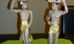 Two figurines in the set, one man one woman both about 12 inches tall.  They are made from plaster with some wear in the style of the artist Gaugin.  Originally purchased in the 1950's.
 
asking $45.00 for the pair.