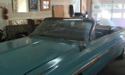 1962 Bonneville convertible. Baby blue with black top. We have original motor and transmission. Lots of parts. $12,000