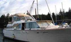 Twin 327 on straight shaft drives,   forward galley custom built,  upper sunbridge fully enclosed, excellent live-a-board.   13.2 foot beam. draft 3.6 feet.