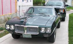 ....1969 pontiac firebird  completely restored from ground up  on rotissorie....close to a midnight green..with dark green interior..33000 miles on original rebuilt 350 motor....with rebuilt automatic transmission at the same time...appraised at $