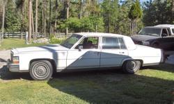 YES this car is now an authentic ANTIQUE, 25 years old, a classic 4 door sedan in perfect condition., Absolutely no signs of rust (never has had any). Luxury car comes with 6 wheels and 8 tires plus the unused original spare. Has a 307 (8 cylinder) motor,