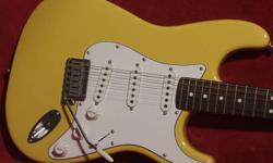 For Sale is my 1988 Fender American Standard Stratocaster in Rare Graffiti Yellow. This guitar is in Near Mint condition and is all original except the strap pegs. No issues, repairs or modifications! Original pickups, electronics, tuners, frets etc.