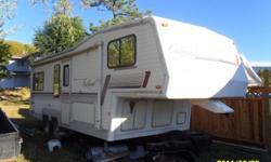 1991 Oakland 26" fifth wheel.
 
Winter package - drinking, grey & black water tanks heated when furnace is running.  Double windows.
Double door fridge and freezer, A/C, pantry and lots of cupboards and storage.
Will sleep six. Queen size bed, couch and