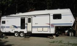 Beautiful 33 FT. FIFTH WHEEL - $11,700.00
Hardwall unit with 2 slides
12' slide in Living Room & 6.5' slide in Bedroom
Living Room - all newly decorated with:
New laminate & tile floors throughout
New sofa with queen size air mattress
New matching rocker,