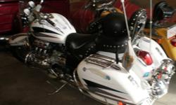 1997 HONDA VALKYRIE, WHITE WITH MURALS. HARD BAGS, NEW TIRE, FLAG POLES, RUNS EXCELLENT, WINDSHIELD, DRIVING LIGHTS, CHROME ACC. 2 BACKRESTS, RECENTLY CERTIFIED, DEALER CHECK OVER. BEAUTIFULL HWY BIKE.  $8,900.00 CASH
