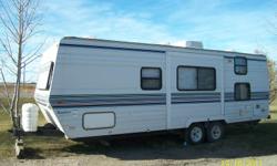 ?1997 25' travel trailer,made by Komfort. Has a dinette slide,queen size bed with door for privacy, couch that folds to a bed,dinette folds to a bed also. Has 2 bunks, fridge stove,freezer,microwave,stereo,A/C,furnace,2- 30lbs propane bottles full.Put