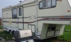 Solid 5th wheel camper, with full kitchen, skylight, bathroom with shower, 2 - 30 pound propane tanks, new batteries. Everything is in working order, we lived in it for 5 months while finishing our house. One slide with sofa, dining room table and chairs