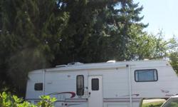 Reduced.1998 Jayco Eagle 5th wheel. Reduced to $6,700 OBO. 26' with a 12' (automatic) slide out. kitchen: oven, microwave,4 burner stove, fridge, sink, lots of cupboards.BR: toilet and tub. Sleeps 6:Private Queen bed, with closet and storage. Couch folds