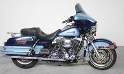 The ultimate in luxury touring is the Harley Davidson Ultra Classic! In electric blue this is the show stopper. There is no place like the open road on this motorcycle with a two up seat, AM/FM cassette player, saddlebags and crash bars you're ready to