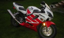 2001 CBR F4i, Red and White, fuel injected, all stock except for fender eliminator and flush mount lights. Never been abused, always serviced, tires and chain and sprockets in good shape. Low km's. Been dropped once in a driveway, fiberglass has been