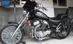 2002 suzuki intruder 1400cc, black with blue pearl and grey,  under 18000km windshield, saddlebags, throttle rocker, coffee holder, jardine pipes, jet kit! just had appraised at $4300obo, she is beauty and the beast all rolled into one! very quick and