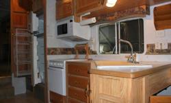 33' with 2 slides... Lots of storage and closet space.. Queen bed, a/c, fantastic fan, and much more!