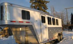3 horse angle haul 7'' wide 7'' tall
Drop down windows with bars and screens,sliders on tail side.
3/4 rubber mats on floors,rubber lined walls.
Collapsable rear tack with 3 tier adjustable saddle rack.
Carpet in dressing room,camper door with screen.
4