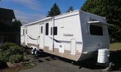 2006 DUTCHMEN 31G-DSL
31FT TRAVEL TRAILER **14FT SLIDE-OUT**
**IDEAL FOR PERMANENT SITE WITH BIG KITCHEN & SEPARATE BEDROOM**
 
This Beautiful 31ft Travel Trailer Includes 2 Entry Doors (One to Living Area / One to Bedroom), Huge Kitchen with Wrap Around