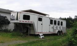 Aluminum 4-horse trailer with all the bells and whistles. BRAND NEW TIRES. Stud wall dividers, under manger storage, bus windows with drop down feed doors, rear tack. 7'9" short wall in gooseneck area. Insulated, lined and wired for 110. Includes queen