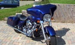 2007 Street Glide Cobalt blue pearl. Programmable Thunder Max EFI unit plugs into laptop.  Down load different loops. Rinehart true duels,Stage 1 air intake, quick detach passenger & driver back rest. Factory alarm system, 40watt CD stereo.13,500 miles,