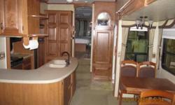 5th wheel Features:
Mor/ryde hitch
4 slides
10 gal water heater
50 amp
Ladder
Electric awning
Huge pass through storage
Generator prep
Electric hitch jack
Aluminum frame
2 recliners
Free standing dinette
Skylight
2 door refrigerator
Microwave
Stove w/