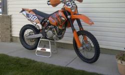2007 KTM XC-W 450 
$4900 obo.
1202km, 102 hrs.  Comes with bark busters, skid plate, REKLUSE Autoclutch, radiator guards, electric fan, steering stabilizer, fork bleeders, fork seal savers, 3 airfilters and lighting kit.  Electric and kickstart.  Awesome