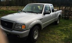 Silver ford ranger sport. V6 5 speed. S/cab with access doors and jump seats. Excellent condition. 189894 km.
Dent on RR fender.