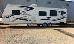 This camper has it all!!!  Two full slides, lots of length, tons of storage, room for everyone!!  Outside showers, two propane tanks, tinted windows, large fridge/freezer combo.  Counter space, large double sink, and tons of cabinets. This camper has been
