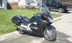 Black 2009 Honda ST1300A, ABS brakes, heated grips and helibar riser. New condition with only 8900KM