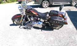 2009 SOFTAIL DELUXE 96 ci. 2 TONE Root Beer brown. Low kms. Stored indoors - lady driven - excellent condition - very well maintained. Accessories include- sissy bar/luggage rack, back seat, leather saddle bags, mustache bar, windsheild, factory Harley