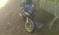 i have a black and gold 2009 yamaha R6 with 4950km on it. it as a two brothers slip-on exhaust, black windshild,& tail light kit, its been serviced by yamaha  every year iv had it. its really a new bike, i only used it 3 times this summer, i dont have the