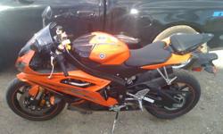 2009 Yamaha YZFR6 Orange & Black. Don't really want to part with the bike but do need to sell it as i have a lot on my plate right now. I bought this bike in Calgary brand new, it has just over 9300Kms, kept in very good condition. New Michelin Pilot