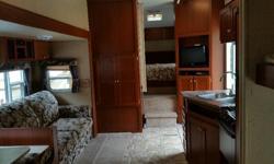 This has been an awesome 5th wheel.
Very roomy, with 8' ceilings and large super slide.
Everything is accessible when the slide is in, the bedroom, the bathroom, fridge, stove, sinks, all amenities!!
Extremely clean and well cared for.
One owner, used