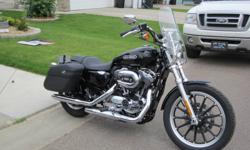 2010 XL 1200 cc Harley Davidson Sportster, black, 1411km, like new. No gst, comes with windshield and saddlebags. Stored in heated garage. Asking $13,000.00, call Gail at 780-996-9778.