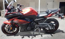 Yamaha FZ6R - 600cc - 4 cyl - 5 spd.
Great first bike if you're wanting to learn. Not too torque-y, but powerful and has that comfortable upright seating position for long trips.
Bought brand new from Action MC. The year is 2011, but I bought it March