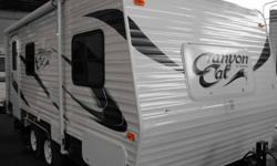 2012 Canyon Cat 17FQ
We have been waiting for Palomino's new Canyon Cat series of light weight trailers. Check out this slide out model trailer that weighs 3983lbs dry. Don't let their weight fool you these are well equiped trailers. Inside you'll find