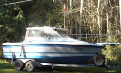 1988, Bayliner- (trophy) with Cabin. 4 cyl. 3 L. inboard OMC.
20 hp merc. kicker. Gal. trailer electric brakes, comes with depth sounder, radios, heater and Lowrance chart plotter. runs good.