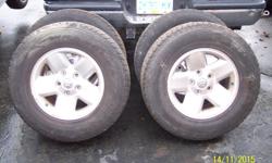 Goodyear wrangler tires 265/70/R17 tires on 2002 Dodge Ram 1500 wheels. comes with lug nuts.