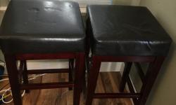 2 leather look, dark wood barstools. $25 for both obo