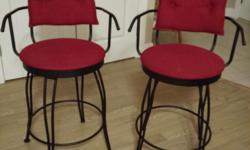 Red, swivel, wrought iron counter stools. 24" high. Like new
