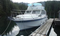 twin 440's,actually fairly economical,12' beam,command bridge,sleeps 6,gally,bathroom,3000 Honda generator,completly set up for chartering,fishing,diving ect... also a 80 foot dock and anchoring,half hour outside Tofino,37,000 will consider trades,boat