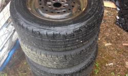 Two almost brand new tires from kal tire only got three months driving on them then the other two are about forty percent tred left on them plus I also have a spare but not on a rim as a extra if needed. Size of rims and tires are 185/70/R14 where on a