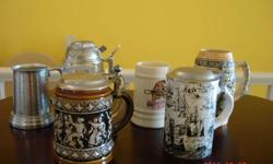 six beer steins from 4 3/4" to 6 1/2"