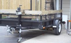 6x10 Utility Trailer 09
    3500 lb load
    front wheel jack, 24" extended sides
    1500 lb winch
    beaver tail ramp
    14" tires, rarely used excellent shape.
    $1500.00
