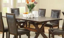 This exquisite rectangular dining table with extension leaf is the perfect centerpiece for your dining room. You'll enjoy the unique design elements displayed in its X inlaid table top design and X style trestle base. The extension leaf generously
