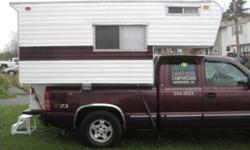 8 ft truck camper. Sleeps 4. Includes 15 amp solar panel. DC Marine Battery. Power inverter. 3 Burner Stove, sink, icebox. Porta Potty.And Small Propane Heater. Carbon Monoxide Detector and smoke alarm.Power and water hookup also. Laminate flooring. Newly